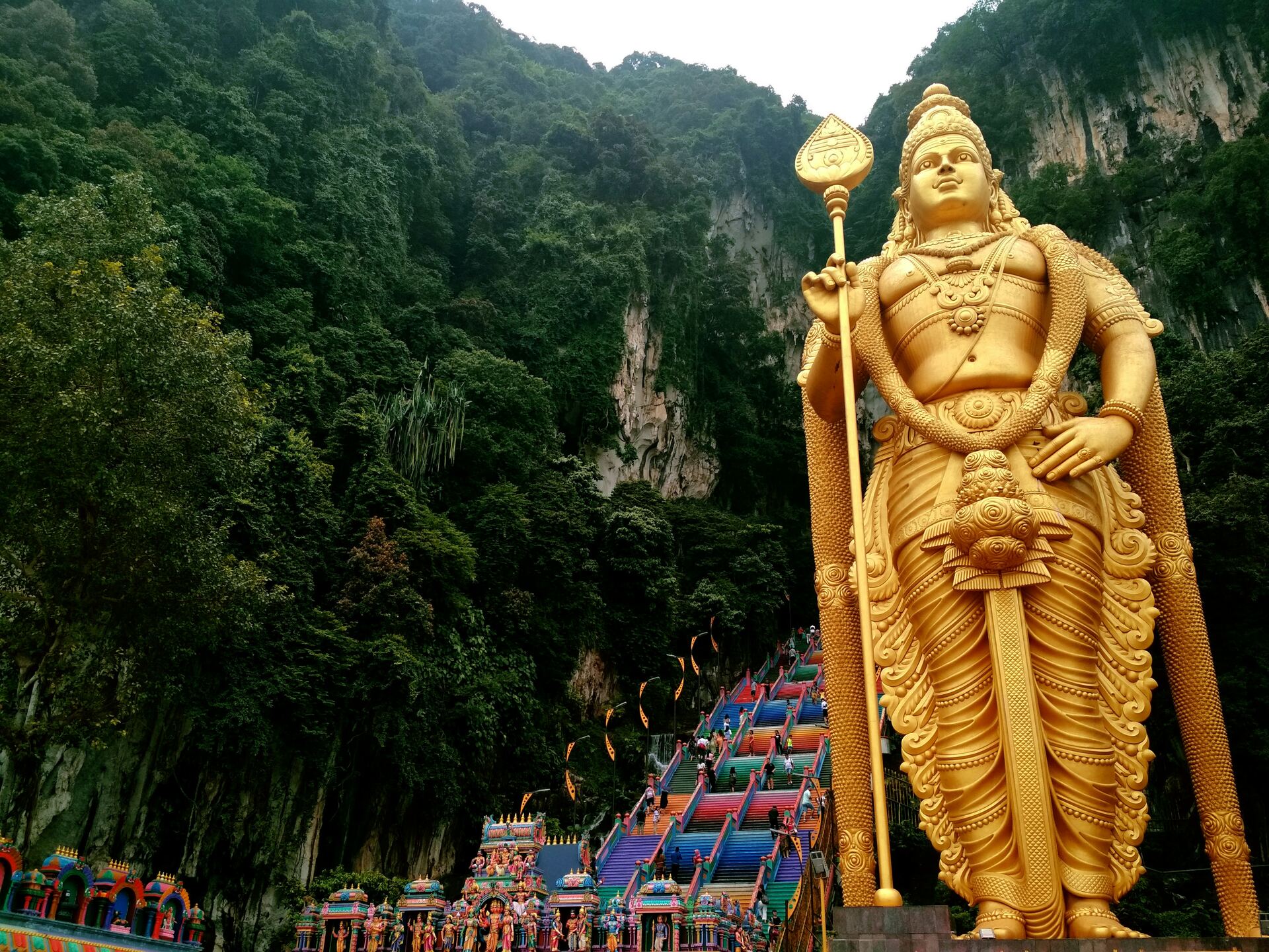 The golden Lord Murugan statue at Batu Caves